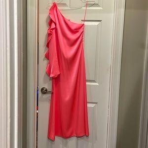 The dress is a David Koma in a beautiful hot pink color in a size 4.